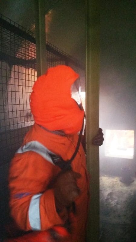 Delegate negotiates our Confined Space in smoke wearing an emergency escape set